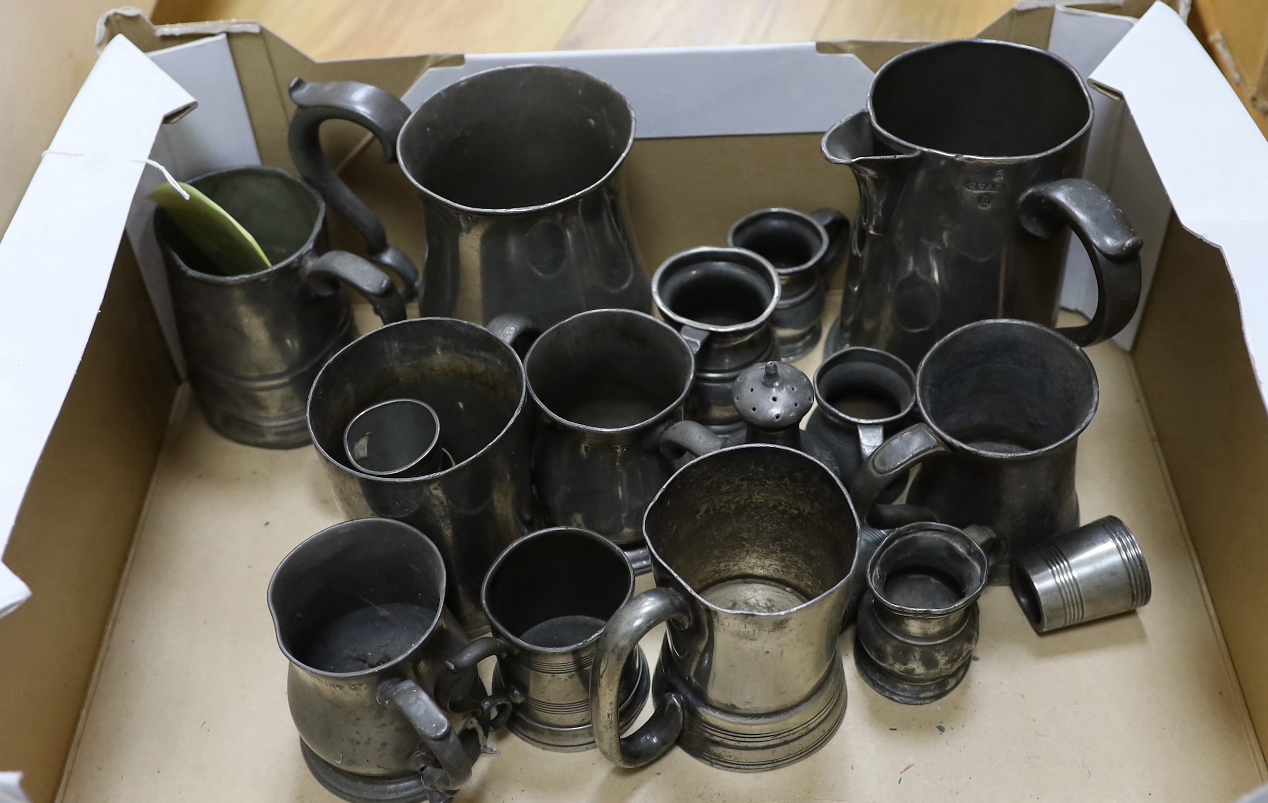 A collection of pewter mugs and measures including, The New Green Man Pub, Watford 1730, The Two Brewers, St Albans 1792 and The Lower Red Lion St Albans 1767, j tallest item 17cm high